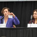 Stephanie Quinn-Davidson, left, of Yes for Salmon, holds up what she says is habitat protection regulation as she debates the merits of Ballot Measure 1 with Kim Reitmeier, representing Stand for Alaska, during a Get Out the Native Vote Southeast forum at Elizabeth Peratrovich Hall on Tuesday, Oct. 9, 2018. (Michael Penn | Juneau Empire)